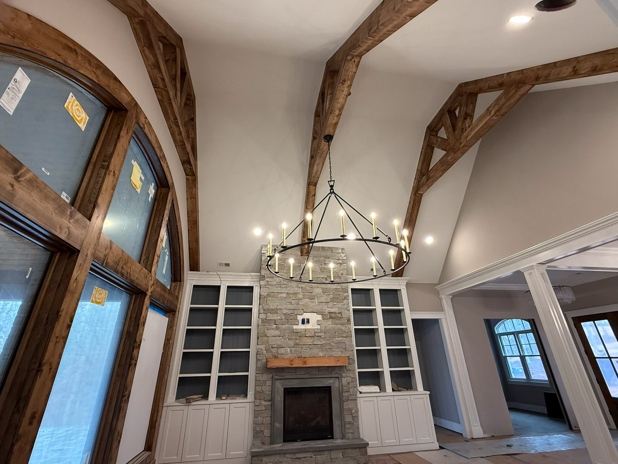 Finished great room with chandelier and custom lighting