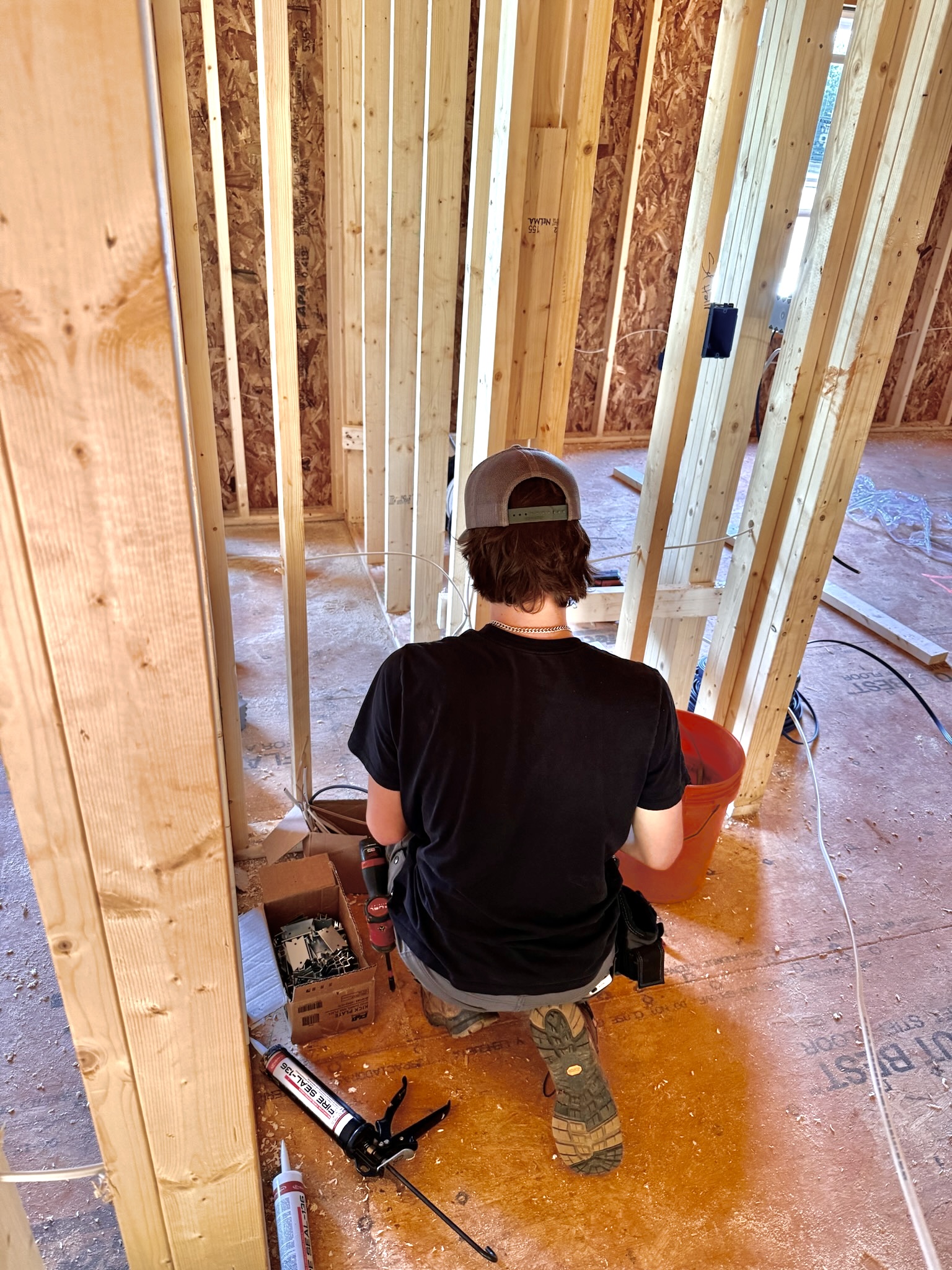 Open wall framing with electrical rough-in wiring